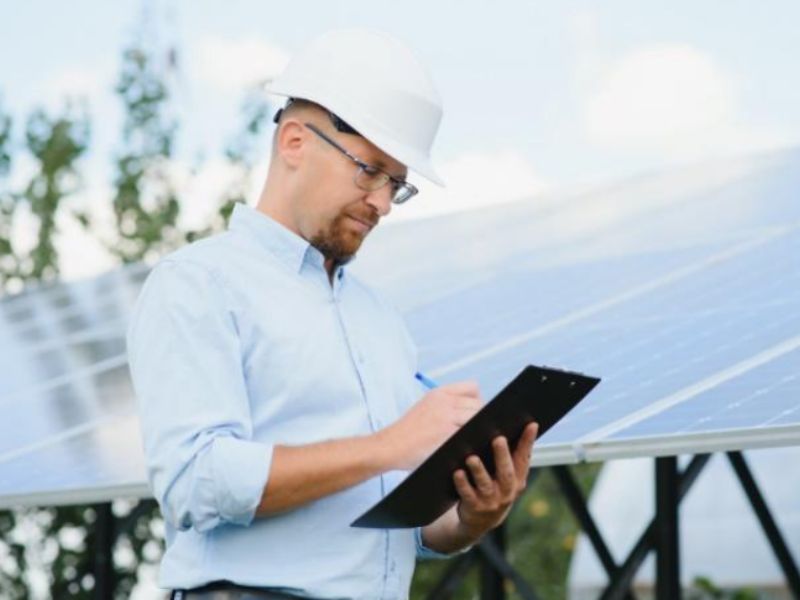 Man doing a solar panel inspection